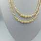 Zweireihige Halskette aus cremefarbenen Perlen