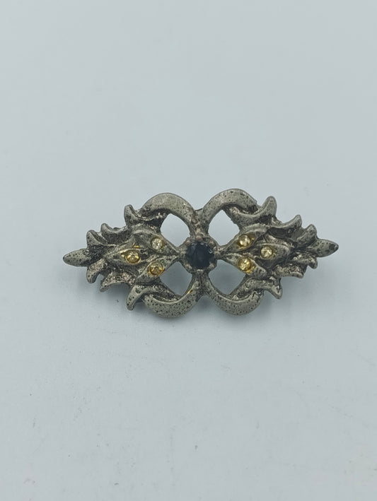 Antikstil Brosche mit gelben Strasssteinen und dunklem Mittelstein