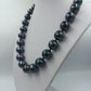Halskette mit schwarzen schimmernden Perlen eleganter Modeschmuck klassisch