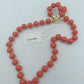 Korallenfarbene Perlenkette mit Goldverschluss 58 cm