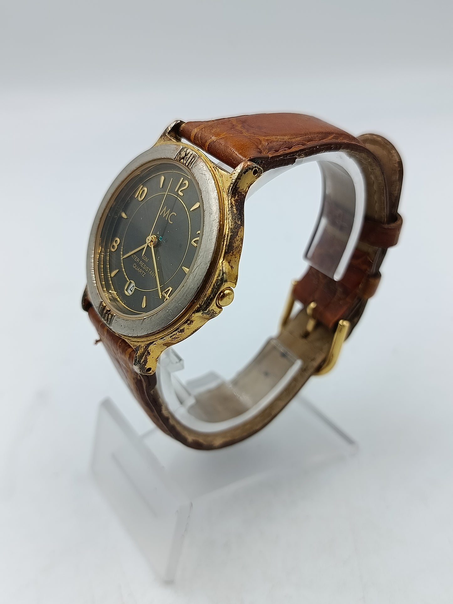 Vintage MC Armbanduhr mit Datumsanzeige und braunem Lederarmband