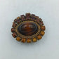 Vintage Brosche mit braunen Cabochons und gedrehter Kordel