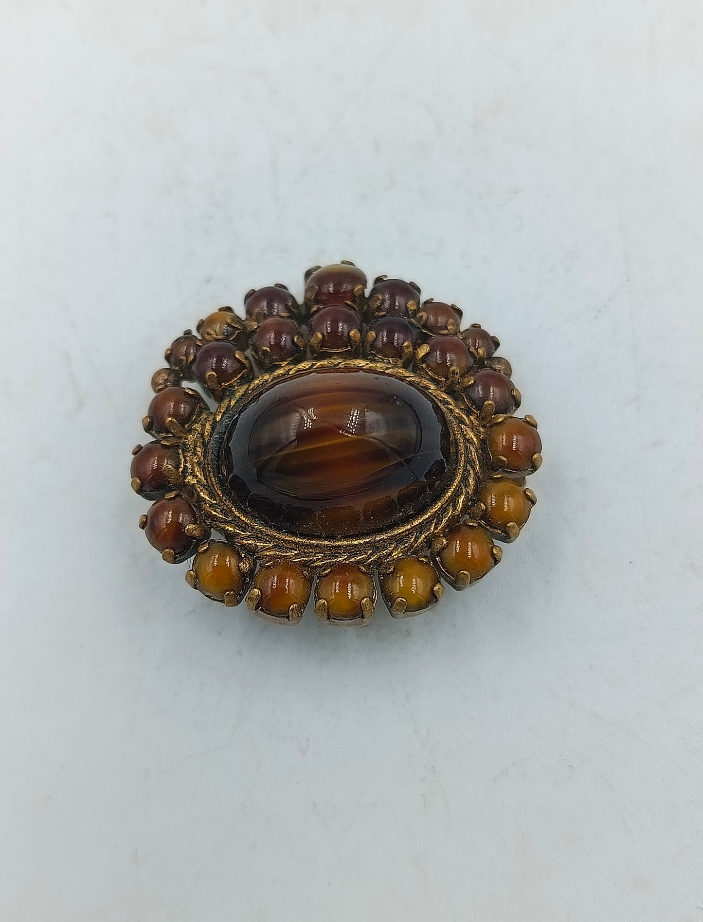 Vintage Brosche mit braunen Cabochons und gedrehter Kordel
