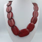 Statement-Halskette mit roten Naturstein Elementen