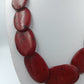 Statement-Halskette mit roten Naturstein Elementen
