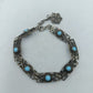Silberfarbenes Armband mit türkisfarbenen Steinen im filigranen Vintage Stil