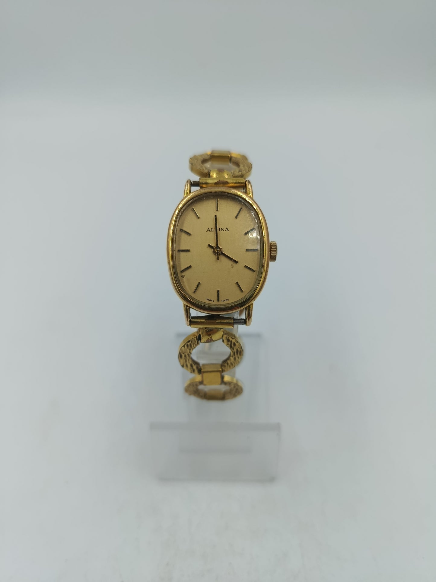 Alpina Vintage Armbanduhr mit goldenem Gehäuse und dekorativem Gliederarmband