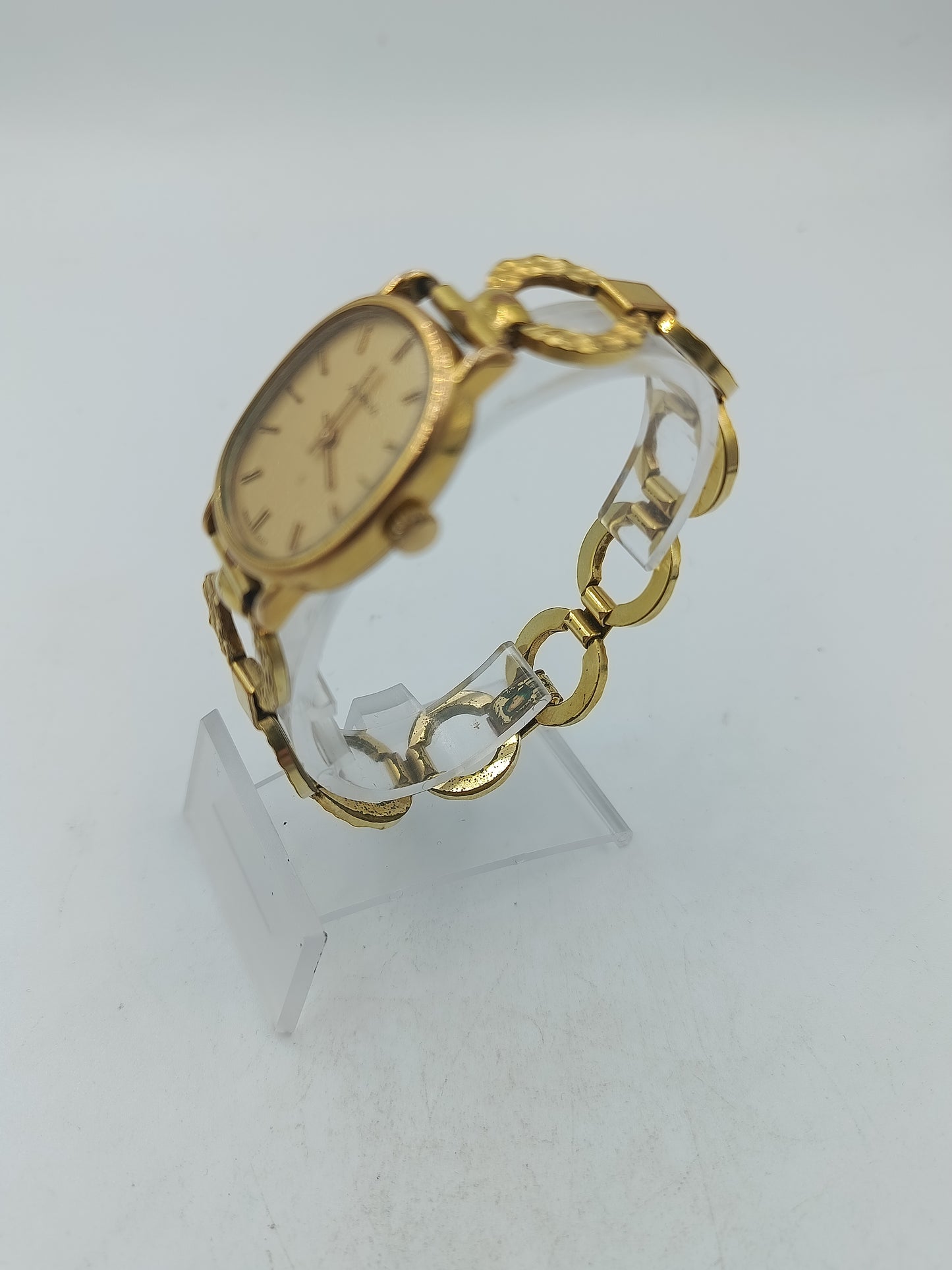 Alpina Vintage Armbanduhr mit goldenem Gehäuse und dekorativem Gliederarmband