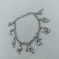 Silbernes Charm Armband aus 925 Silber mit Delfin Motiven und verspieltem Design