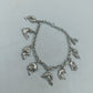 Silbernes Charm Armband aus 925 Silber mit Delfin Motiven und verspieltem Design