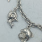 Silbernes Charm Armband aus 925 Silber mit Delfin Motiven und verspieltem Design