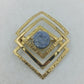 Geometrische Schmuckbrosche goldfarben mit Naturstein und modernem Quadrat Design