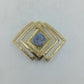 Geometrische Schmuckbrosche goldfarben mit Naturstein und modernem Quadrat Design
