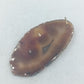 Natürlicher Stein Anhänger in Braun mit organischer Form und einzigartiger Maserung