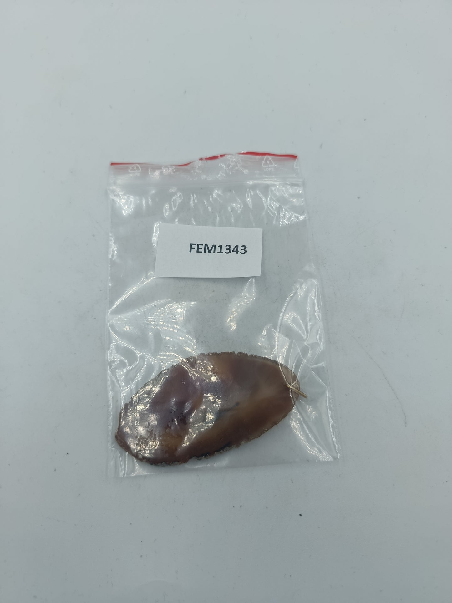 Natürlicher Stein Anhänger in Braun mit organischer Form und einzigartiger Maserung