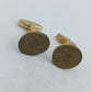 Runde Manschettenknöpfe mit antik wirkendem Wappenmotiv in klassischem Goldton
