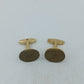Runde Manschettenknöpfe mit antik wirkendem Wappenmotiv in klassischem Goldton