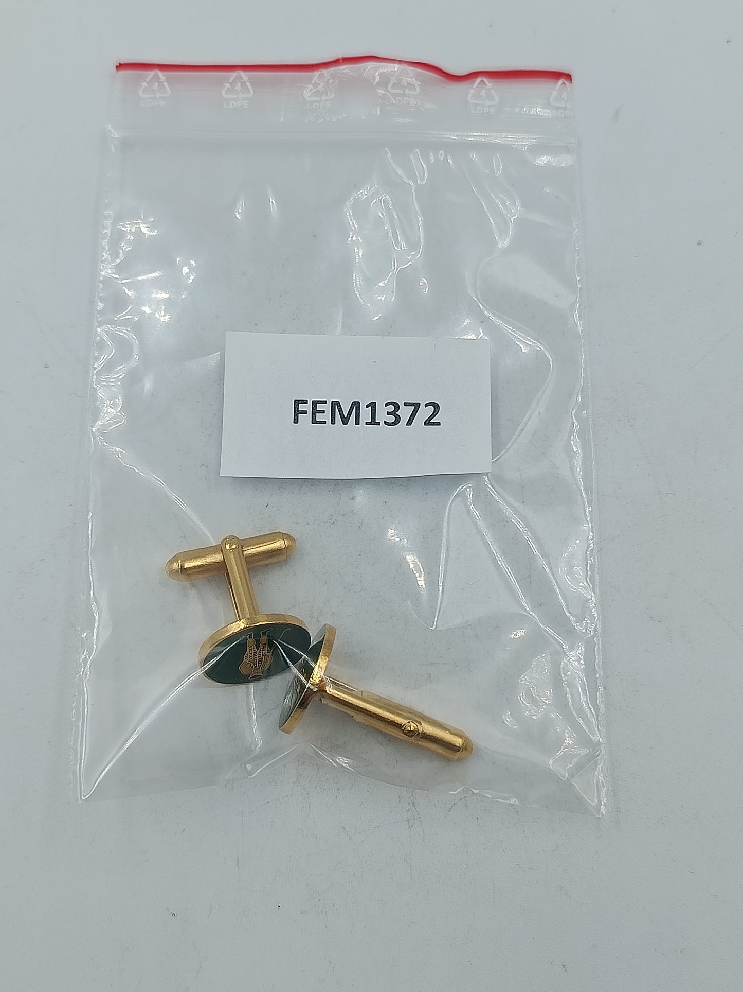 Golfer Manschettenknöpfe in goldfarbener Optik mit dunkelgrüner Emaille