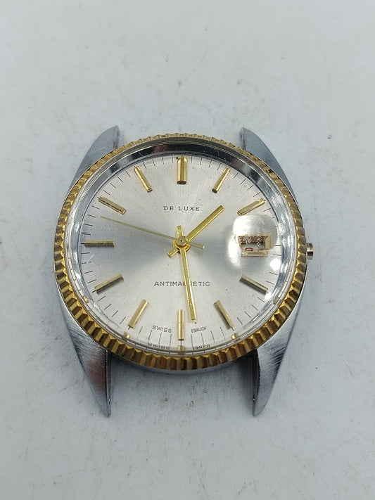 Klassische Schweizer Armbanduhr De Luxe mit goldfarbener Lünette