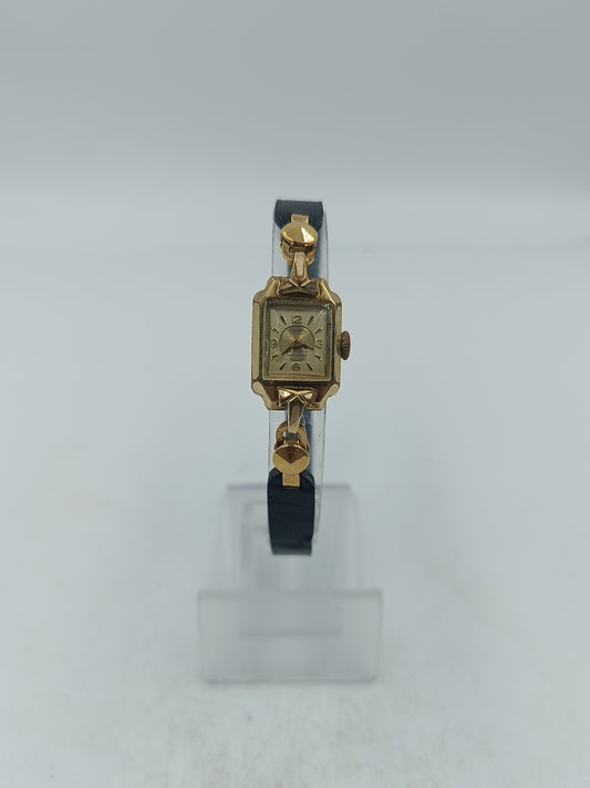 Goldfarbene Armbanduhr mit schwarzem Lederband Seiko Quartz