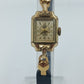 Goldfarbene Armbanduhr mit schwarzem Lederband Seiko Quartz