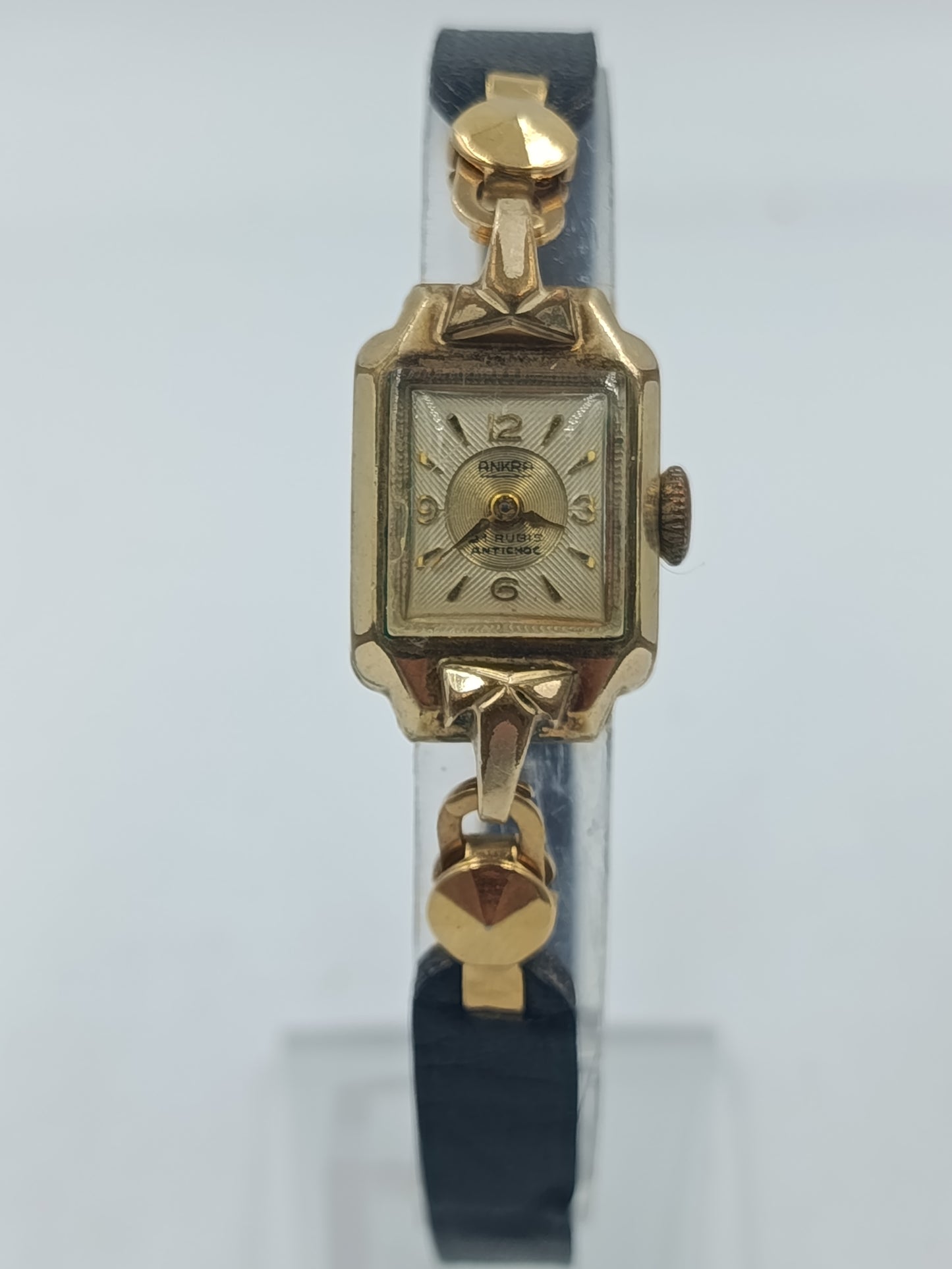 Goldfarbene Armbanduhr mit schwarzem Lederband Seiko Quartz
