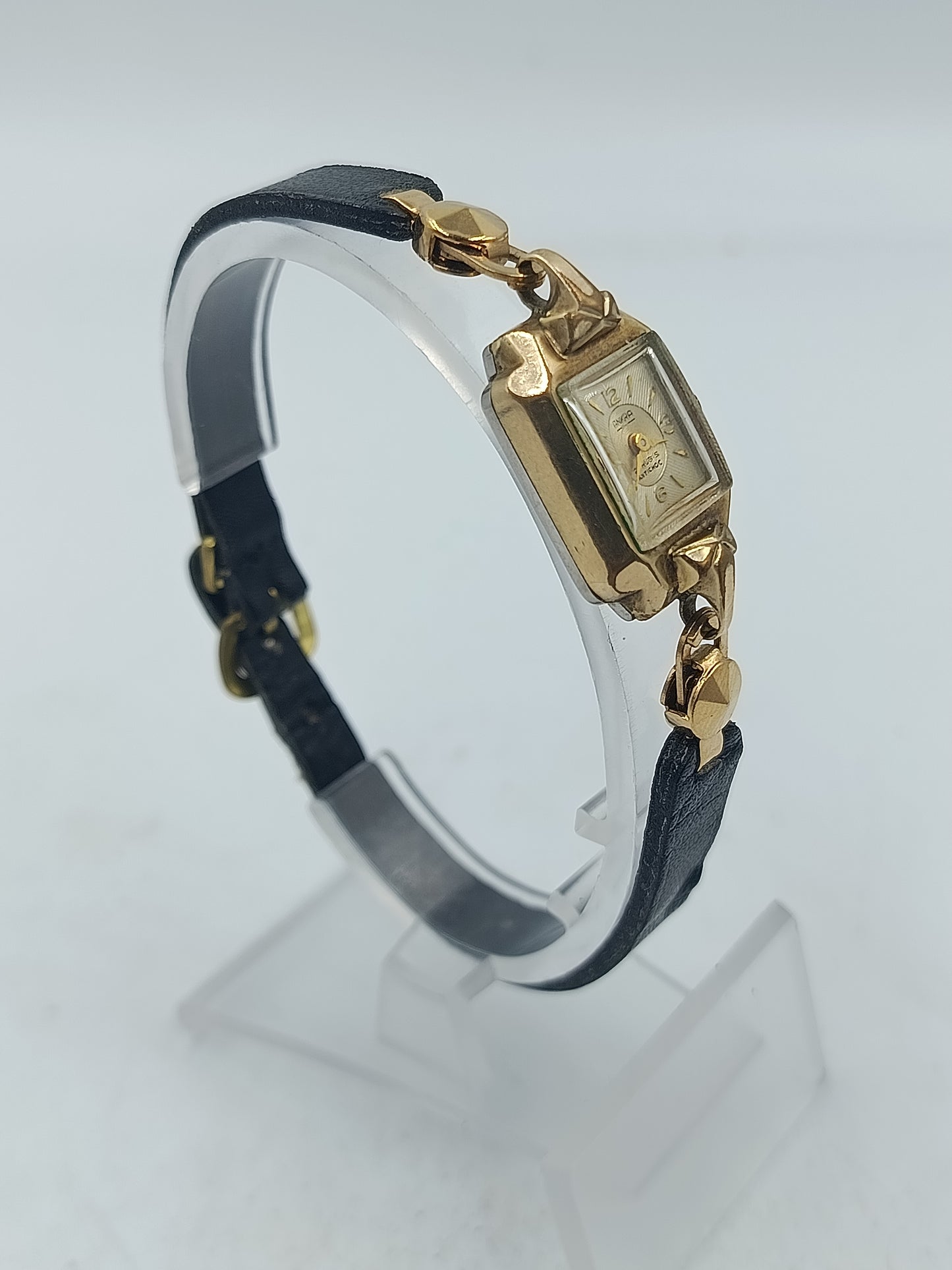 Goldfarbene Armbanduhr mit schwarzem Lederband Seiko Quartz