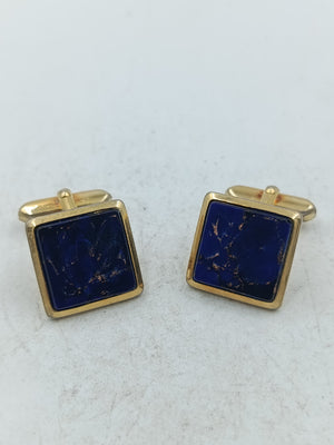 Elegante Manschettenknöpfe in Goldoptik mit tiefblauem Steineinsatz