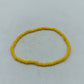 Schlichtes elastisches Armband aus gelben Glasperlen für sommerliche Akzente