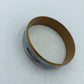 Eleganter Armreif in Goldoptik mit pastellfarbenem Streifendesign