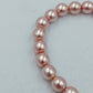 Elastisches Perlenarmband in zartem Rosé mit klassischem Glanz