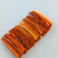 Markantes Armband in Bernsteinoptik mit warmen Orangetönen