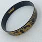 Schmaler Vintage Armreif in Schwarz Gold mit asiatischen Tiermotiven