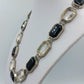 Elegante Gliederkette mit schwarzen und klaren Schmucksteinen