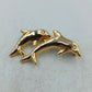 Goldfarbene Brosche mit zwei springenden Delfinen in elegantem maritimem Design