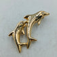 Goldfarbene Brosche mit zwei springenden Delfinen in elegantem maritimem Design