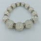 Elastisches Perlenarmband mit Crushed Glasperlen und Strass Zwischenringen