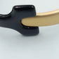 Moderner Armreif in Schwarz und Gold im minimalistischen Design