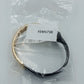Moderner Armreif in Schwarz und Gold im minimalistischen Design