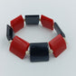 Elastisches Armband mit roten und schwarzen Elementen im modernen Design