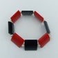 Elastisches Armband mit roten und schwarzen Elementen im modernen Design