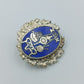 Vintage Anstecknadel mit blauem Emaille Motiv und dekorativem Metallrahmen