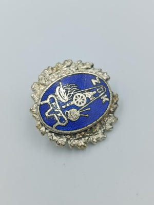 Vintage Anstecknadel mit blauem Emaille Motiv und dekorativem Metallrahmen