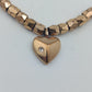 Verstellbares Armband in Goldoptik mit Herzanhänger und funkelndem Stein