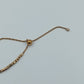 Verstellbares Armband in Goldoptik mit Herzanhänger und funkelndem Stein