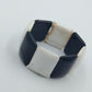 Elastisches Armband in Schwarz Weiß mit geometrischen Elementen
