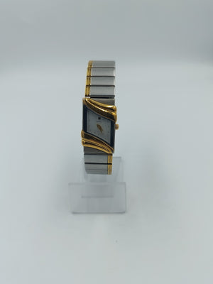 Elegante Bicolor Damenuhr mit geschwungenem Gehäuse in Gold und Silberoptik