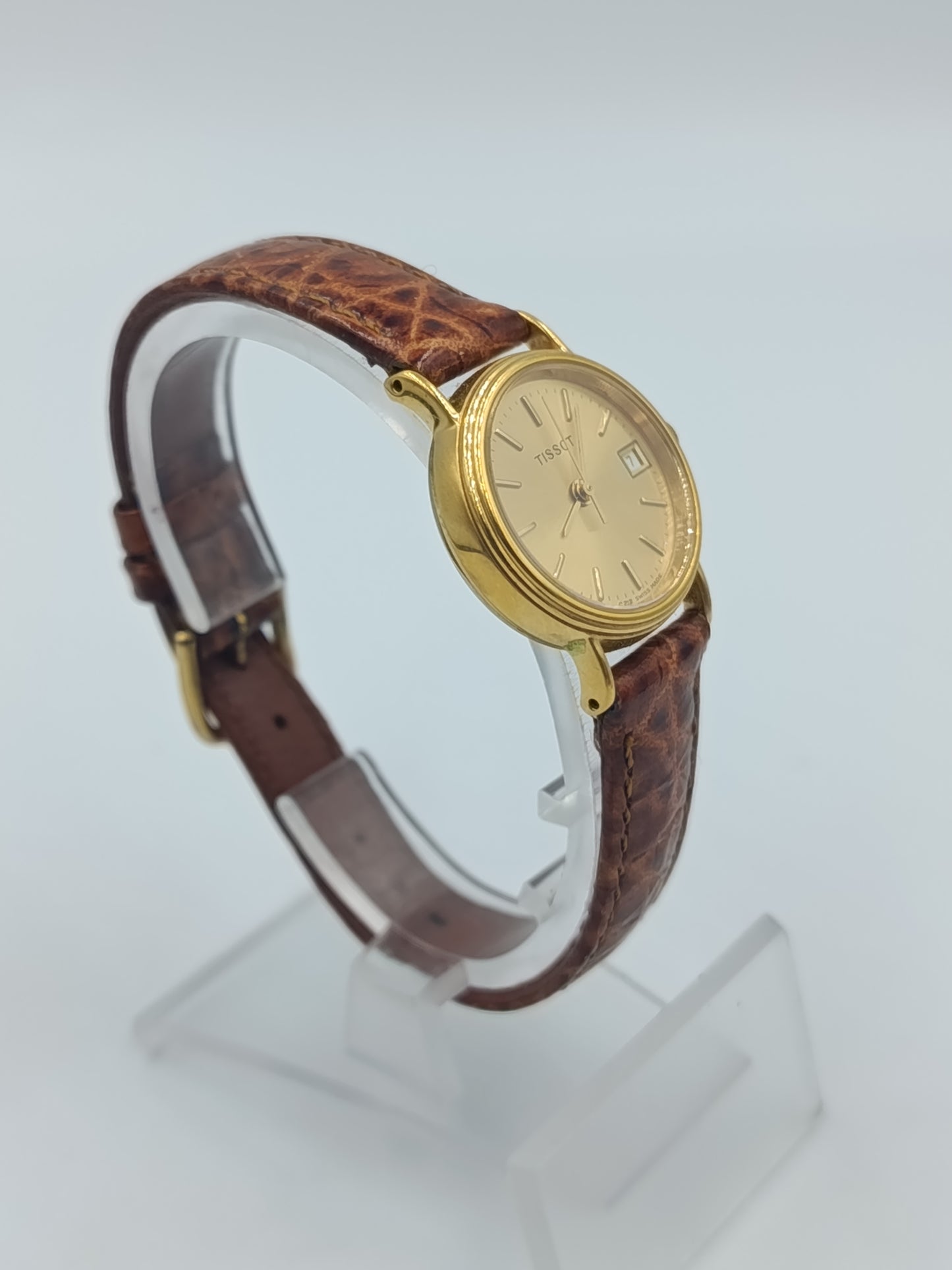 Elegante Tissot Damenarmbanduhr Goldfarben mit Datumsanzeige Lederband