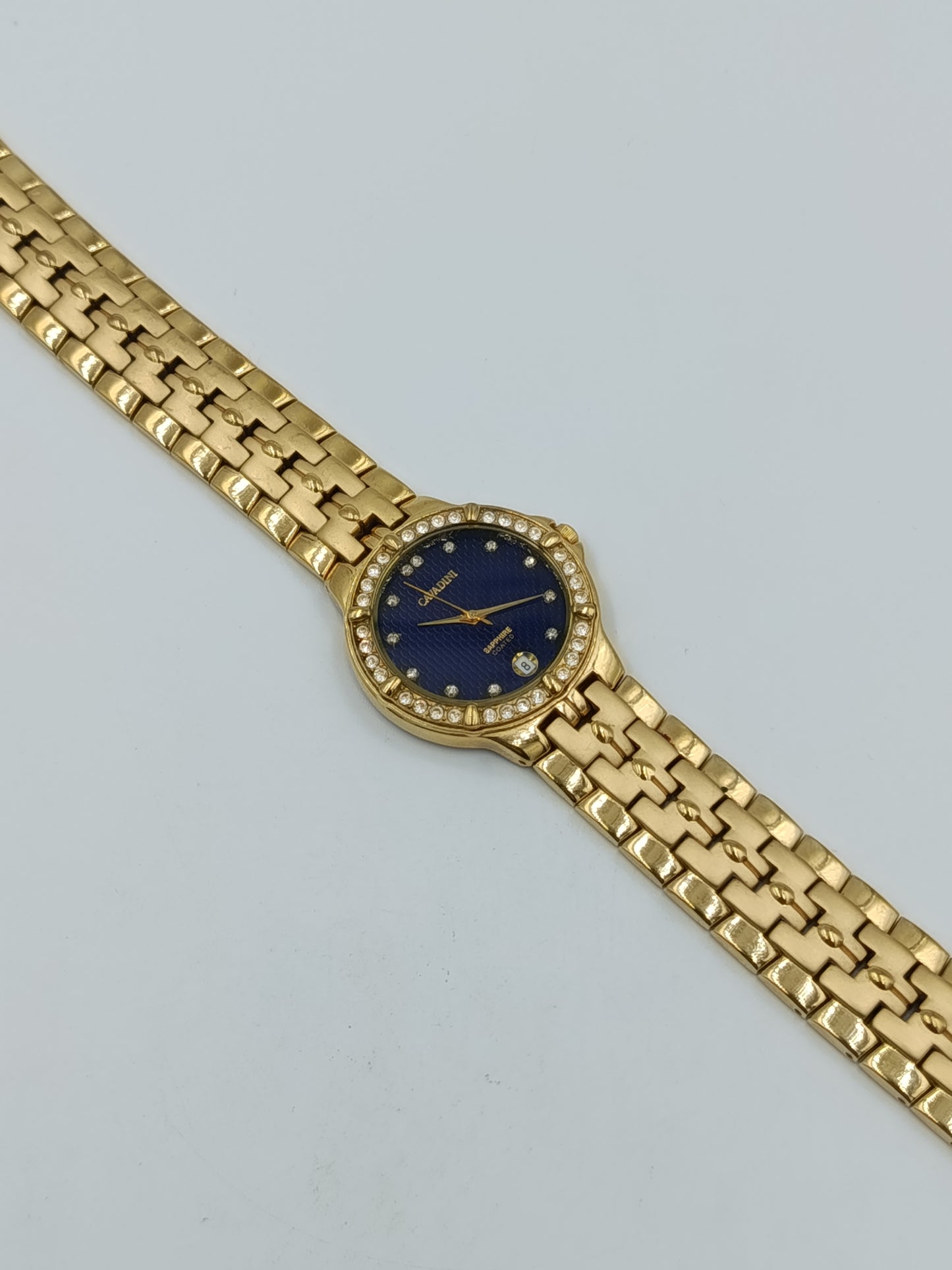 Cavadini Damen Armbanduhr in Goldoptik mit blauem Zifferblatt und Ziersteinen