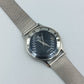 Elegante CK Calvin Klein Damenarmbanduhr mit Milanaiseband und römischen Ziffern